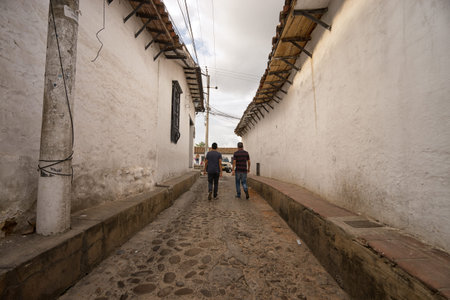 July 23, 2017 Giron, Santander: people walk through the narrow cobblestone colonial street of the tourist townのeditorial素材