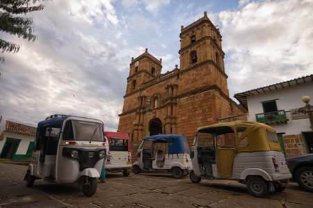 July 21, 2017 Barichara, Colombia: small three wheeled taxis waiting for customers in the town centerのeditorial素材