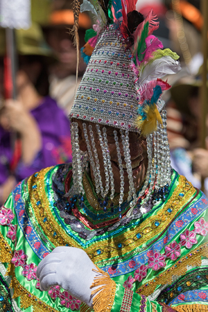 June 17, 2017 Pujili, Ecuador: man wearing a colorful costume marching at the annual Corpus Christi paradeのeditorial素材