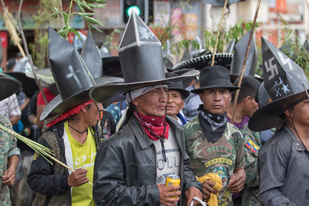 June 29, 2017 Cotacachi, Ecuador: indigenous men wearing extra large sombreros dancing in  the main square of the town at Inti Raymiのeditorial素材