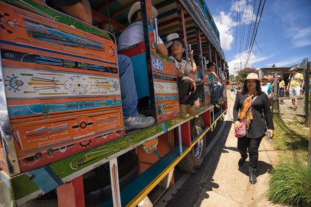 August 6, 2017 Medellin, Colombia: old colourful buses called 'chiva' used for transportation and as party bus during the annual flower festival in Santa Elenaのeditorial素材