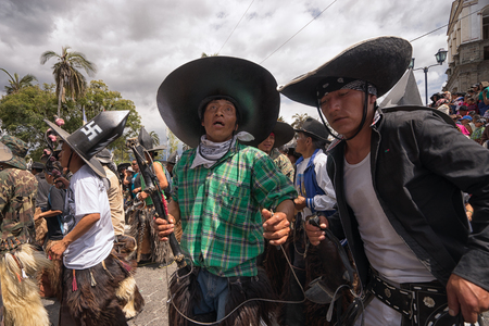 June 24, 2017 Cotacachi, Ecuador: indigenous kichwa men participating in a parade at summer solsticeのeditorial素材