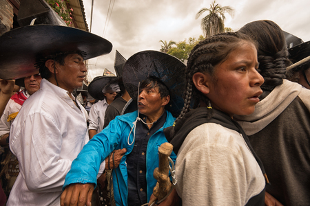 June 24, 2017 Cotacachi, Ecuador: closeup of indigenous kichwa men  participating in a parade at summer solsticeのeditorial素材