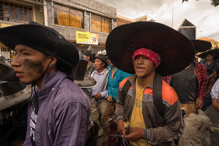 June 24, 2017 Cotacachi, Ecuador: closeup of indigenous kichwa men  participating at an Inti Raymi parade at summer solsticeのeditorial素材