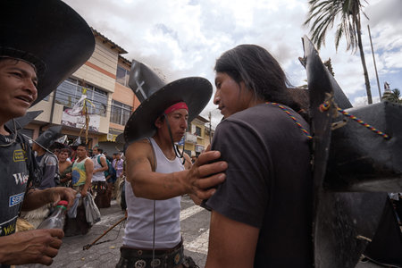 June 24, 2017 Cotacachi, Ecuador: closeup of indigenous kichwa men  participating at an Inti Raymi parade at summer solsticeのeditorial素材