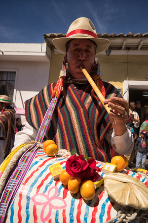 June 17, 2017 Pujili, Ecuador: indigenous quechua male drummers setting the rhytm for the Corpus Christi parade dancersのeditorial素材