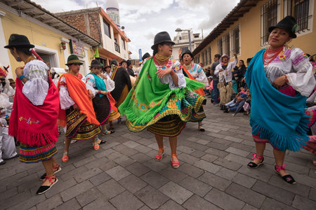 June 17, 2017 Pujili, Ecuador: women dancers in brightly colored clothing at the Corpus Christi...