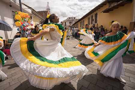June 17, 2017 Pujili, Ecuador: female dancers in traditional dress during Corpus Christi paradeのeditorial素材