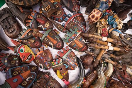 Indigenous quechua face masks made of wood  selling on the streetの写真素材