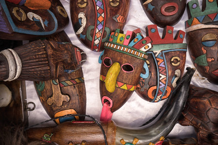 April 29, 2017 Otavalo, Ecuador: indigenous quechua face masks made of wood  selling on the street in the Saturday marketのeditorial素材