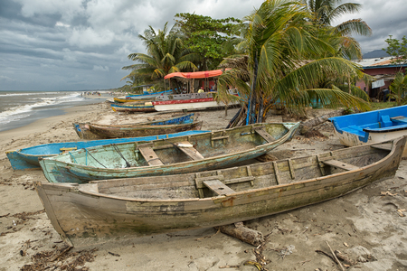 March 8, 2015 Sambo Creek, Honduras: dugout canoes on the beach by the samll garifuna fishing villageのeditorial素材