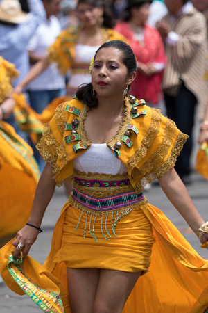 June 17, 2017 Pujili, Ecuador: woman dancer in colorful dress at the Corpus Christi annual paradeのeditorial素材