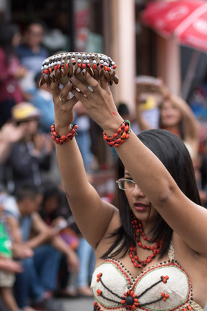 June 17, 2017 Pujili, Ecuador: female dancer from he Amazon area at the Corpus Christi annual paradeのeditorial素材