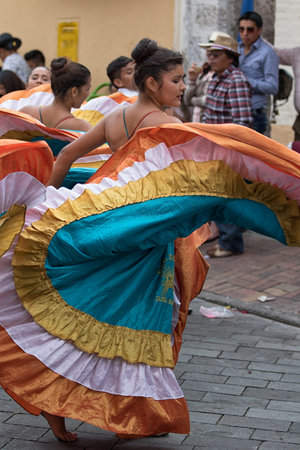 June 17, 2017 Pujili, Ecuador: indigenous female dancer in colonial style dress at the Corpus Christi annual paradeのeditorial素材