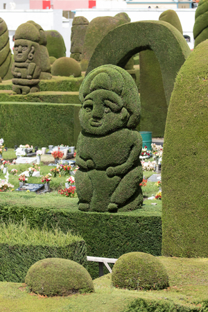 May 16, 2017 Tulcan, Ecuador: green statues created from cypress bushes at the extensive topiary of the local cemeteryのeditorial素材