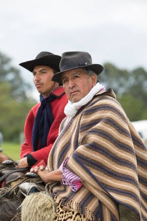 May 27, 2017 Sangolqui, Ecuador: quechua indigenous cowboy also known as chagra on horseback wearing traditional clothingのeditorial素材