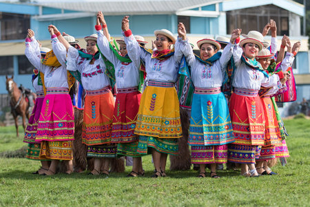 May 27, 2017 Sangolqui, Ecuador: indigenous quechua women in colourful traditional costumes...