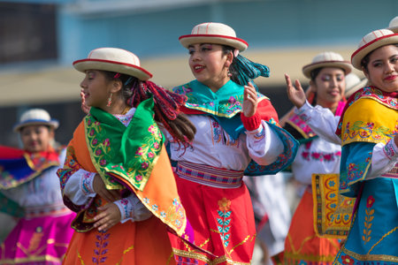 May 27, 2017 Sangolqui, Ecuador: indigenous quechua women in colourful traditional costumes...