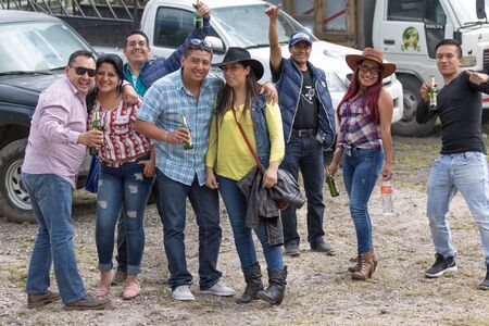 May 27, 2017 Sangolqui, Ecuador: people attending a local rodeo posing in the parking areaのeditorial素材