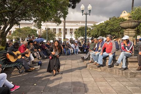 March 2, 2017 Quito, Ecuador: a woman singer is performing in the park in the front of people on a weekend dayのeditorial素材