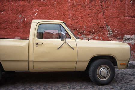 March 2, 2016 San Miguel de Allende, Mexico: a vintage truck parked in the cobblestone street of the...
