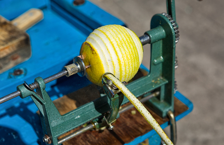 manual orange peeler used by many street vendors in mexicoの写真素材