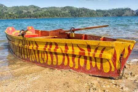 December 22, 2014 Lagunas de  Montebello National Park, Mexico: colourful wood boat on the shore of the blue water of Cinco Lagos is popular with touristsのeditorial素材