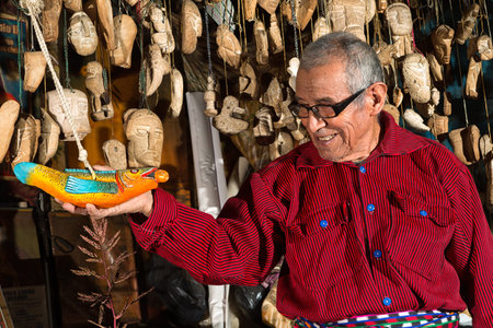 January 30, 2015 San Pedro la Laguna, Guatemala: illustrative editorial of a Mayan artist creating small statues from volcanic pumiceのeditorial素材