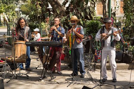 February 8, 2015 Antigua, Guatemala: street musicians entertaining tourists in the central park of the colonial tourist townのeditorial素材