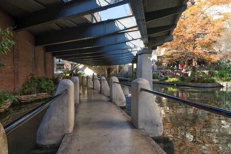 January 8, 2016 San Antonio: the river walk crossing under a bridge in the downtown areaのeditorial素材