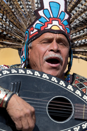 March 4, 2016, San Miguel de Allende, Mexico: indigenous dancer playing its instrument  and chanting at  the Senior de la Conquista celebrationのeditorial素材