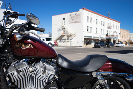 December 17,2015 Alpine,Texas:  closeup of a motorbike on the street with building in the backgroundのeditorial素材