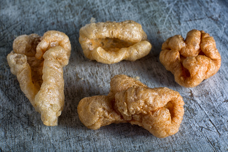 deep fried pig skin treats called cueritos or chicharronの写真素材