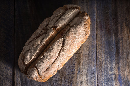 loaf of bread on rustic wooden background