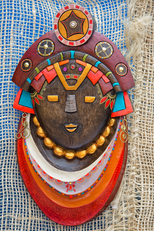 Otavalo, Ecuador- March 24, 2018: indigenous colourful wood mask on display at the artisan marketの写真素材