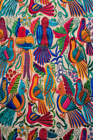 Otavalo, Ecuador- February 17, 2018: bird themed indigenous handcrafed textile closeup in the...