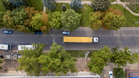 Aerial view from above of the vehicular intersection,  traffic at peak hour with cars on the road.の写真素材
