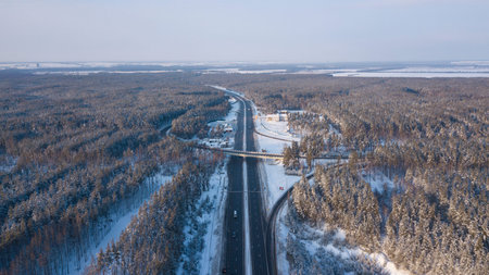 Winter aerial photo of transport junction, traffic cross road junction day.