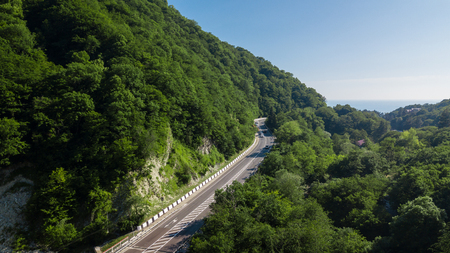Curved asphalt highway road in mountains of South Russiaの写真素材