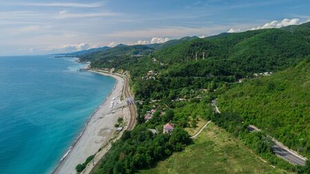 Aerial view from drone - winding road from the high mountain pass in Sochi, Russia.の写真素材