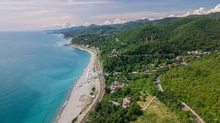 Birds Eye View - winding road from the high mountain pass in Sochi, Russia. Great road trip trough the dense woods.の写真素材
