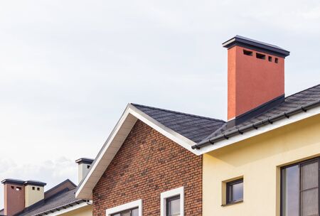 Soft roof, roof tiles, flexible shingles. Roof tiling texture. Flexible, soft bituminous compositeの写真素材