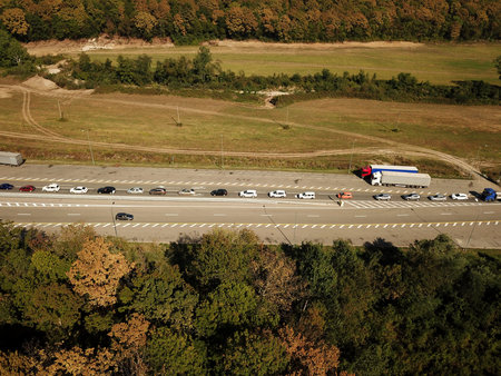 Autumn aerial image of transport junction, traffic cross road junction day view from above. Top down...