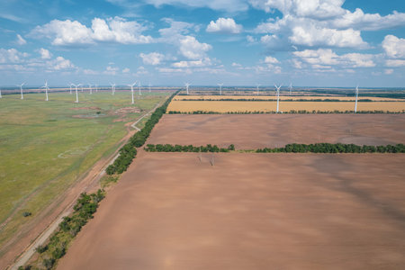 Aerial view of Wind power turbine is a popular sustainable, renewable energy source on beautiful...