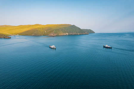 A ferry from the east coast to Olkhon Island Khuzhir at sunrise. Lake Baikal. From the side of the island.の写真素材