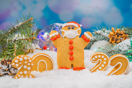 Christmas background with gingerbread 2022. Holiday mood card. Family traditions, DIY, celebration concept. Festive background with homemade gingerbread cookies.の写真素材