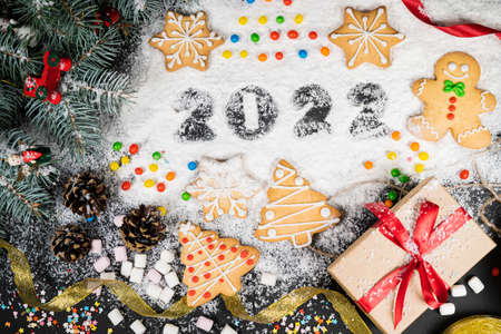 New years 2022 holidays composition on snow backgroundの写真素材