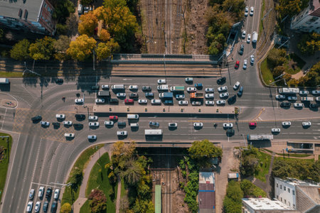 Drones point of view - traffic jam top view, transportation concept, intersection crossroad aerial view from above. Road traffic on crossroad or intersection downtown.の写真素材