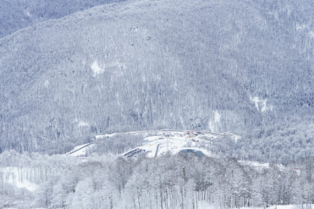 Winter mountain landscape: The Rosa Khutor Alpine Resort near Krasnaya Polyana panoramic background.