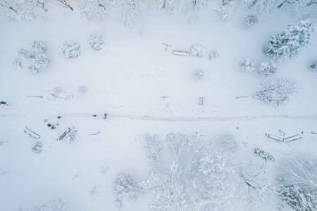 Aerial top down view of snowy city asphalt road, landscapes in winter.の写真素材